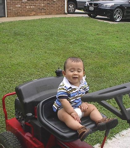 Jarred and the Snapper! Ten more years before he will be cutting the grass!
