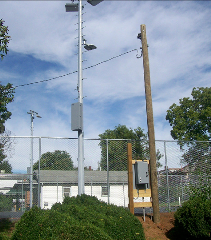 The fence is up, and the night floodlights!