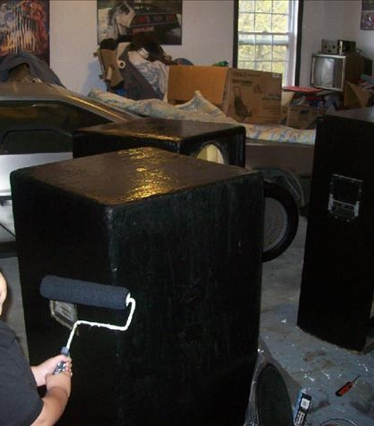 Helping Dad do some work, painting his speakers!