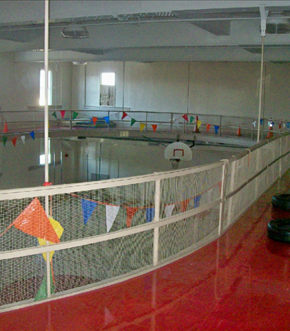 Upstairs there was a indoor track for running. It is now a flat floor, and the spiral staircase leads downstairs!
