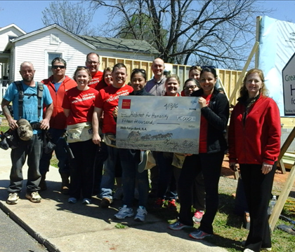 April 2016, The Wells Fargo crew building a habitat house on Knight St!. Zee is the seventh from the left!