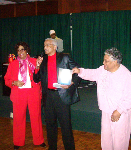 Hattie, Reggie, and Odessa, drawing the name for the door-prize!